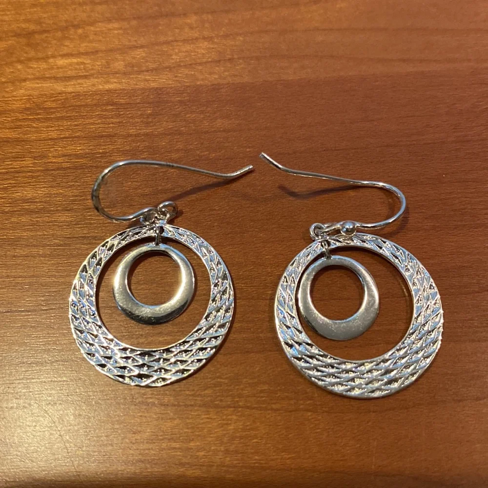 10 pairs of silver tone earrings